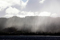 Rain shower across Sandy Island, the Grenadines, Caribbean, January 2010.