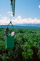 Camerawoman Justine Evans filming presenter Sir David Attenborough in a canopy crane on location for BBC Natural History Unit series 'Life of Birds'. Venezuela, 1997