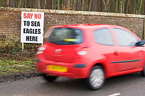 "Say No to Sea Eagles here" sign by roadside at Holkham, North Norfolk, UK, Feb 2010