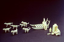 Dogs, dogsled and figures carved in walrus ivory by the famous Magsanguassuaq. Qaanaaq, Northwest Greenland.