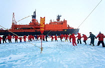 Tourists from Russian nuclear icebreaker "Sovetskiy Soyuz" dancing around the world at the North Pole, 1998.