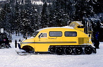 Bombadier converted for tourist use in the snow at Yellowstone National Park, USA, 1996.