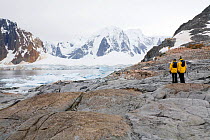 Visitors taking in the view at Port Charcot, Booth Island, Antarctica, February 2009.