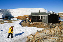 Visitors to Wordie House, established in 1947, now a historic site. Winter Island, Antarctica, February 2009.