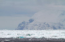 Cape Vincent, Elephant Island seen across 15 nautical miles of pack ice. South Shetland Islands, Antarctica, 2009.