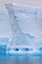 Icicle fronted caves in tabular iceberg, Antarctica, 2009.