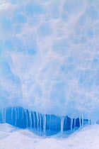 Icicles at entrance to cave in a small iceberg, Antarctica, 2009.