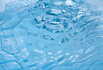 Ripples at the centre of a clear piece of glacier ice, Antarctica, 2009.