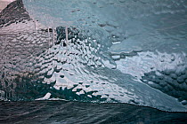 Texture on small piece of clear iceberg ice, Antarctica, 2009.