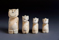 Four walrus ivory carved Billiken figurines from Uelen. Chukotka, Siberia, Russia.