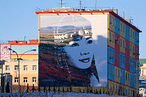 Mural of native Chukchi woman on appartment block in Anadyr. Chukotka, Siberia, Russia, spring 2010