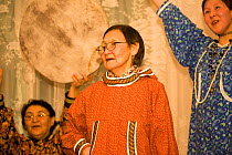 Elderly Yupik Eskimo woman performing traditional drum dance. Provideniya, Chukotka, Siberia, Russia, 2010
