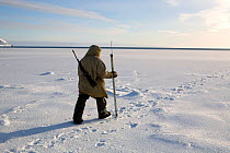 Yupik Eskimo seal hunting at the floe edge in Tkachen Bay. Chukotskiy Peninsula, Chukotka, Siberia, Russia, 2010