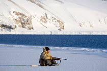 Yupik Eskimo seal hunting at the floe edge in Tkachen Bay. Chukotskiy Peninsula, Chukotka, Siberia, Russia, 2010