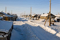 Snow covered street in the native Chukchi village of Neshkan. Chukotkskiy Peninsula. Chukotka, Siberia, Russia, spring 2010