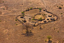 Aerial view of Maasai fenced homestead, with buildings and livestock enclosures. Kenya, Africa, August 2009