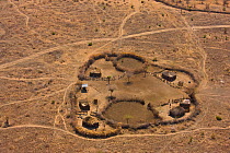 Aerial view of Maasai fenced homestead, with buildings and livestock enclosures. Kenya, Africa, August 2009