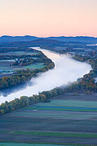 Aerial view of mist rising from the Connecticut River at dawn as seen from South Sugarloaf Mountain in the Sugarloaf Mountain State Reservation, Deerfield, Massachusetts, USA, October 2006