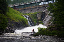 Man fly-fishing on the Connecticut River just below the dam of First Connecticut Lake, Pittsburg, New Hampshire, USA, Connecticut River Headwaters region, July 2006
