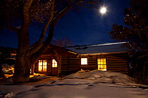 Western ranch at night with full moon, Brush Creek Ranch, Saratoga, Wyoming, USA, February 2010
