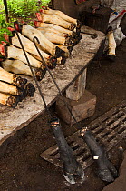 Cooking cow's feet for food, Puerto Ayora, Santa Cruz Island, Galapagos Islands, April 2008