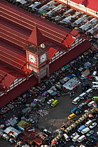 Aerial view of Stabroek market and clock tower with stalls and taxis on the road outside, Georgetown, Guyana, December 2009