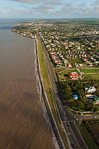 Aerial view of the sea wall protecting Georgetown, a city built below sea level, Guyana, December 2009