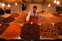 Market trader selling dried fruit and nuts, Djemaa el-Fna (the square), Marrakech, Morocco, June 2009