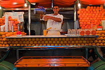 Market vendor selling orange juice, Djemaa el-Fna (the square), Marrakech, Morocco, June 2009