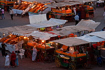 Food stalls in the market at night, Djemaa el-Fna (the square), Marrakech, Morocco, June 2009
