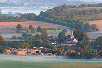 Dawn mist on the fields around the village of South Harting. South Downs, Sussex, UK, September 2009.