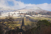 The Church Tower of Crickhowell with the snow covered "Table Mountain" beyond. Brecon Beacons National Park, Powys, Wales, January 2010.