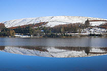 Reflections of snow covered hills in Pontsticill Reservoir. Brecon Beacons National Park, Wales, January 2010.