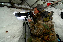 Igor Shpilenok photographing from snow hide igloo, Kamchatka, Far East Russia, photograph by Sergey Gorshkov, January 2007