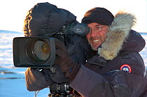 Cameraman Barrie Britton filming in the Belcher Islands, Hudson Bay, Canada. Picture taken during filming for BBC "Planet Earth" TV Series, March 2006.