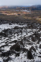 View over the hot spring area west of Hrafntinnusker, frosted sand moraines on ice can be seen in the foreground, Fjallabak Nature Reserve, Iceland, August 2010