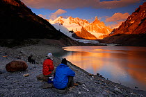Mountaineers watching the sunrise over Cerro Torre (3102 m), Los Glaciares National Park, Andes, Patagonia, Argentina, January 2006