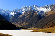 View of Estaing lake frozen, Moneste peak and Arcoeche peak, Pyrenees mountain, Haute-Pyrenees, Gascogne, France, January 2011