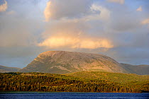 Gros Morne mountain, with sun shining through clouds, Gros Morne National Park, Newfoundland, Canada, September 2010