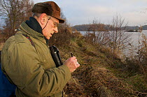 Berlin's beaver expert, Willi Recker, checking for beaver activity, Berlin, Germany, November 2007