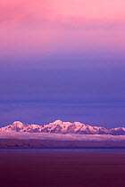 The Cordillera Real range of mountains in the Andes from Lake Titicaca at dusk, Bolivia, December 2009