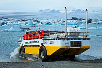 Amphibious tourist vehicle driving into the Jokulsarlon Lagoon, Vatnajokull Glacier, Iceland, July 2009