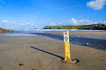 Beach carpark limit sign on Polzeath beach. Cornwall, UK, April 2010.