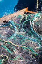 Close up of fishing nets on board trawler. Devon, England, April 2010.