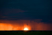 Dramatic sunrise together with rainfall in the outback at the height of the Australian summer. Queensland, Australia, February 2008