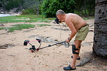 Jurgen Freund photographing a highly venomous Death adder with his home-made video remote controlled camera. Queensland, Australia, February 2008