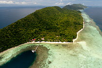 Aerial of Kri Island, Kri Eco Resort and Sorido Bay Resort. Raja Ampat, West Papua, Indonesia, February 2010
