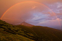 Rainbow over the summit of Mt. Krivan (national symbol of Slovakia) at sunset. Western Tatras, Slovakia, June.