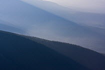 Mist rising from forested ridges in the Western Tatras, Slovakia, June.