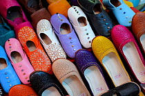 Shoes for sale in a souk market, Fes, Morocco, December 2010.